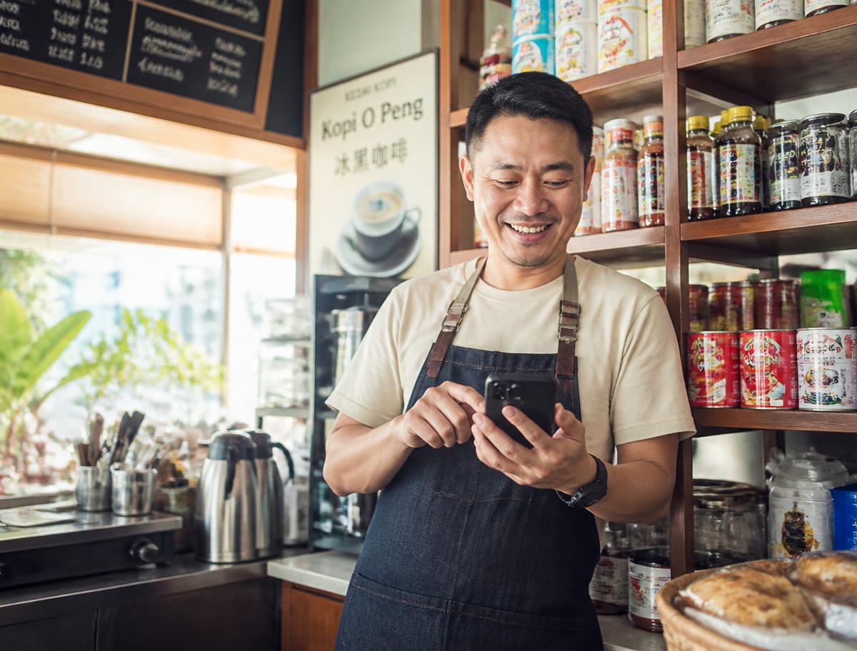 Café owner checking stock levels